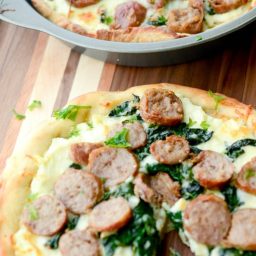 A plate of Sausage and Spinach White Deep dish pizza