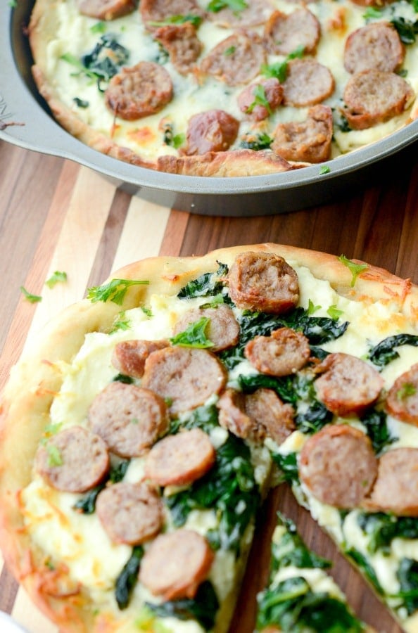 A plate of Sausage and Spinach White Deep dish pizza