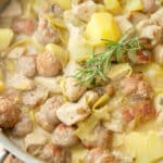 Skillet Chicken, Sausage, Artichokes and Potatoes made with sausage, chicken, artichoke hearts and potatoes in a white wine sauce.