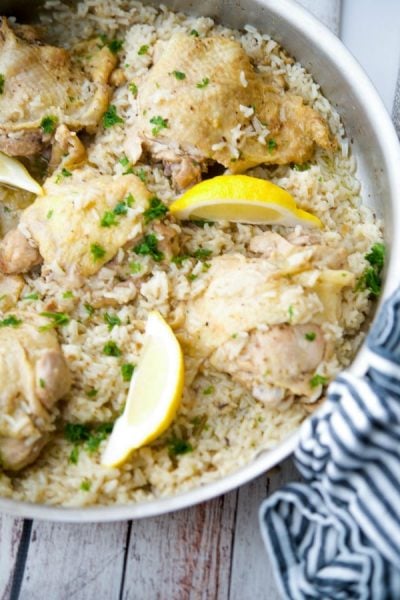 A bowl of food, with Chicken and Rice