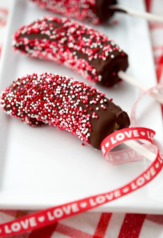 A close up of valentines banana pops on a plate