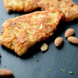 Almond Encrusted Chicken Cutlets on a cutting board