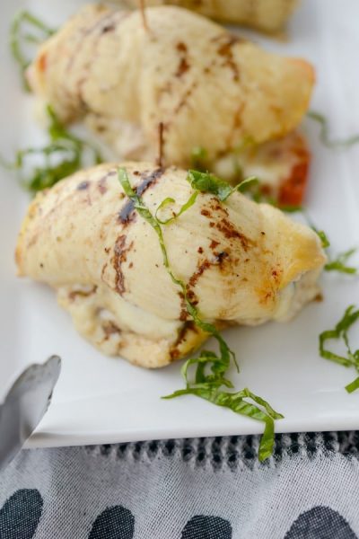 A plate of Caprese Stuffed Chicken on a table