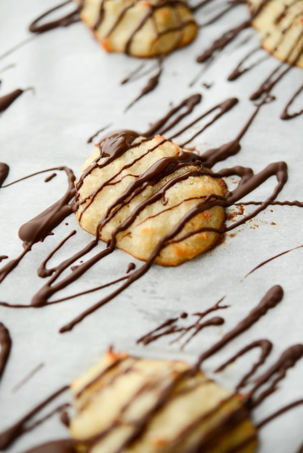 A piece of Chocolate Drizzled Coconut Macaroons