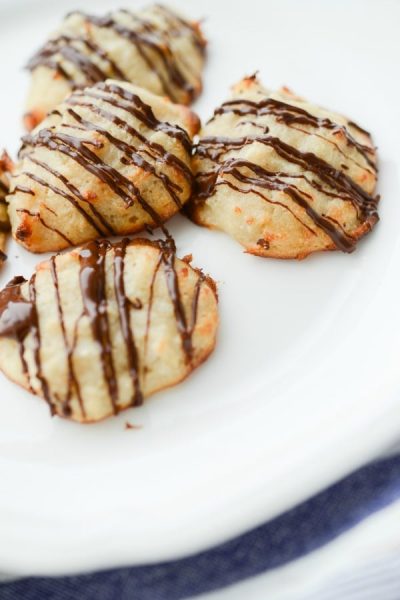 Chocolate Drizzled Coconut Macaroons made with almond flour, coconut and egg whites are a low carb dessert option when you're craving something sweet. 