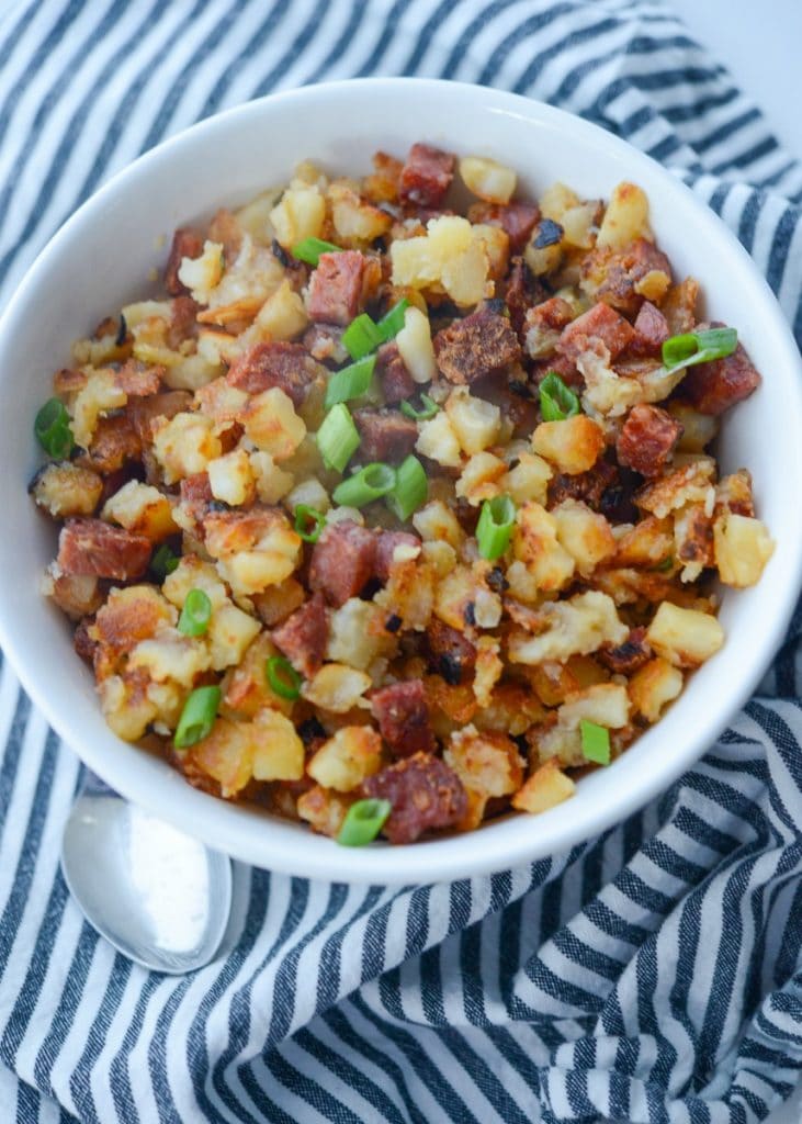 A bowl of Portuguese Chorizo and potatoes on a table
