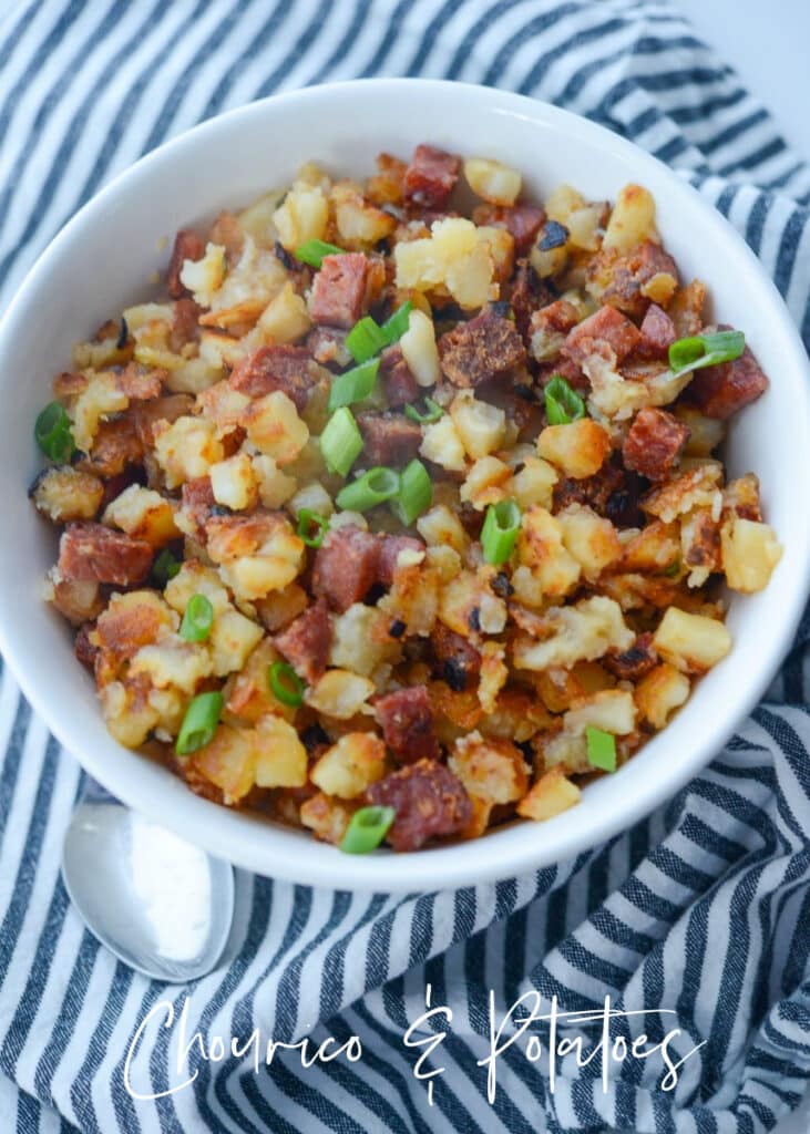 a bowl of diced chourico and potatoes