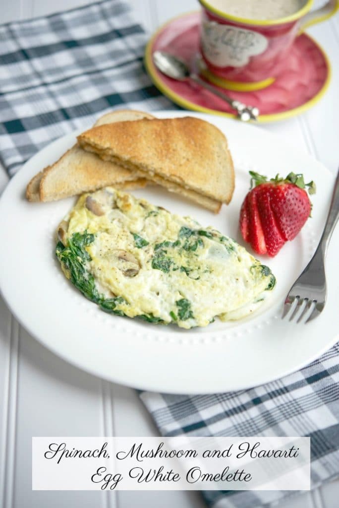 A plate of Spinach, mushroom and havarti egg white omlet