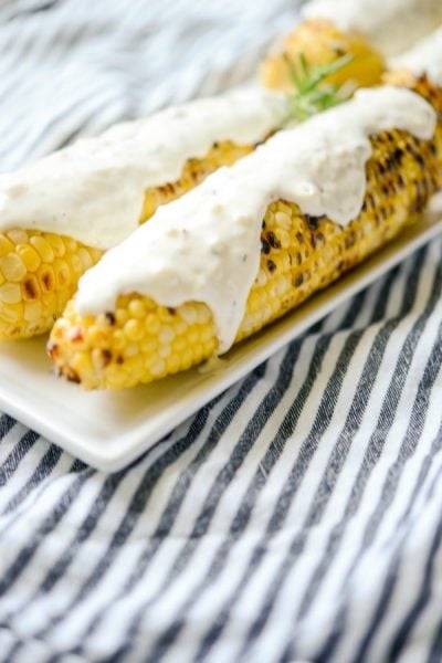 A close up of Italian Style Grilled Street Corn