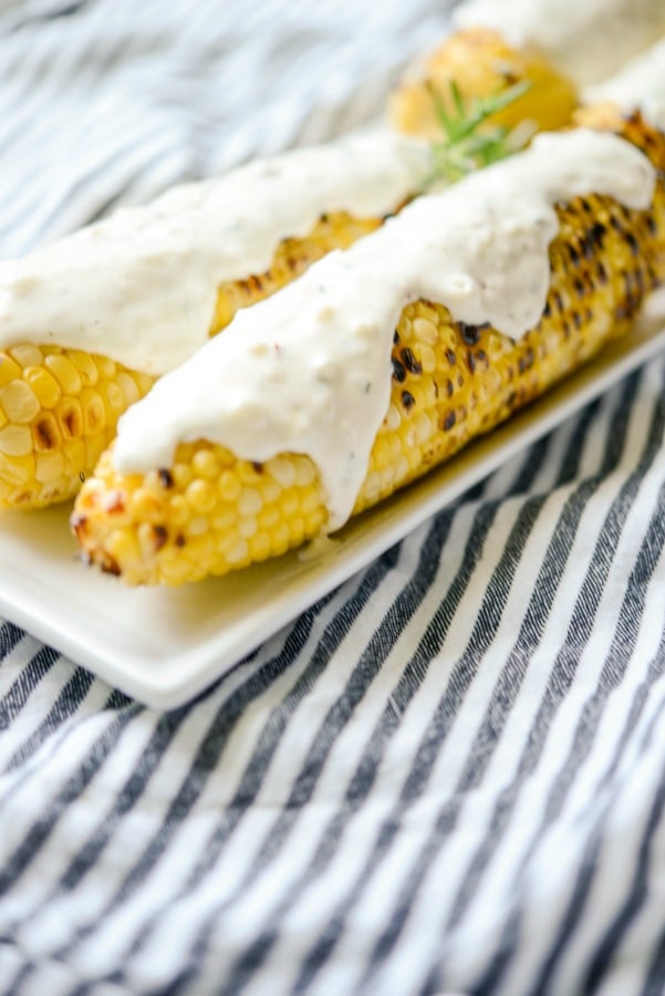 A close up of Italian Style Grilled Street Corn