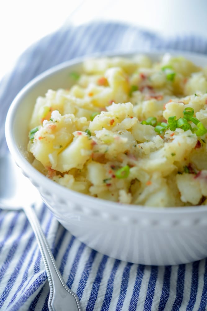 Bacon Ranch Potato Salad in a white serving bowl.