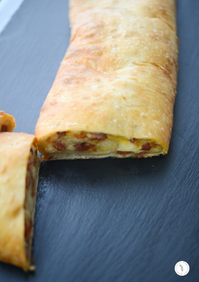 A close up of Portuguese Chorizo Stuffed Bread on a plate