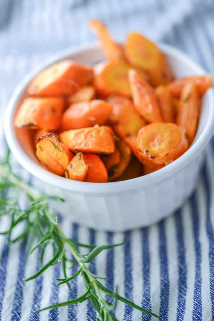 A close up of a bowl of Rosemary Roasted Carrots