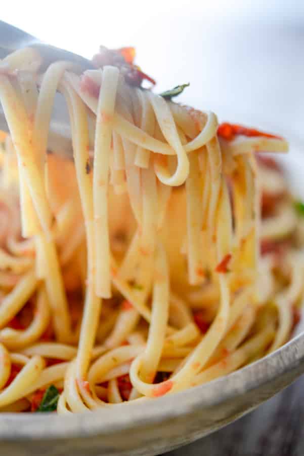 A close up of Linguine Positano Carrabbas with a fork