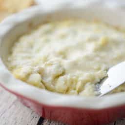 Marinated Hot Artichoke Dip with knife horizontal