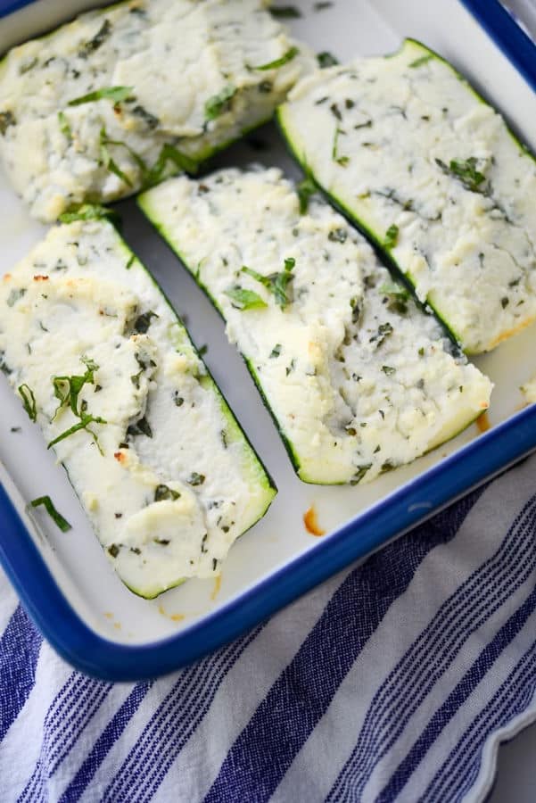 Ricotta, Goat Cheese and Basil Stuffed Zucchini Boats are a tasty vegetable side dish that's not only delicious and easy to prepare, it's low carb too. 