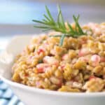 a bowl of farro salad with pomegranates