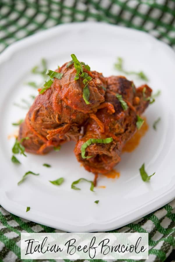 Beef Braciole is an Italian recipe made by stuffing thin slices of beef with prosciutto, basil, garlic, bread crumbs, and grated cheese. 