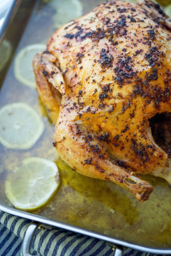A close up of a plate of Lemon Pepper Whole Roasted Chicken