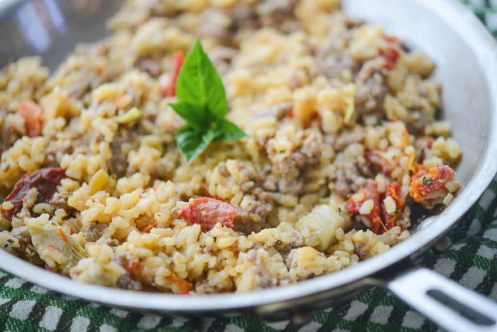 Sausage, Artichoke Hearts and Sun Dried Tomato Risotto in pan