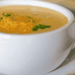 Low Fat Baked Potato Soup in a white crock