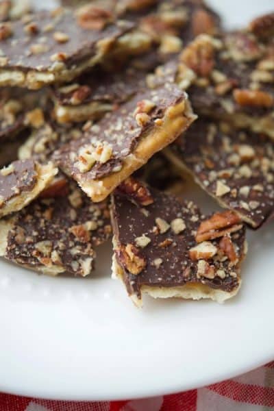 A piece of Sea Salt Dark Chocolate Christmas Crack on a plate