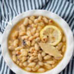 a bowl of cannellini beans in olive oil and spices