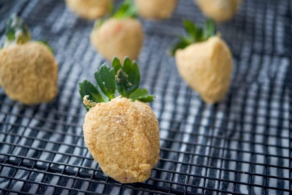 Cheesecake Coated Strawberries on rack