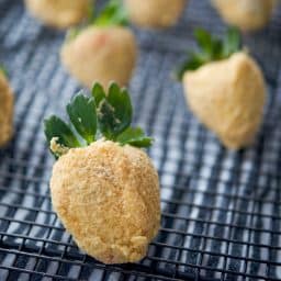 Cheesecake Coated Strawberries on rack