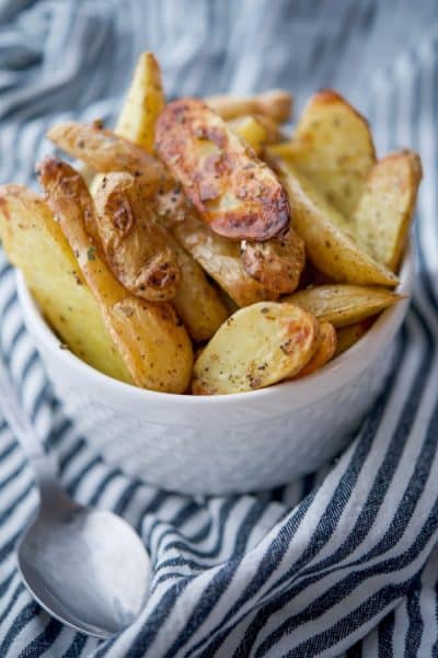 A close up of Greek Roasted Fingerling Potatoes on a table