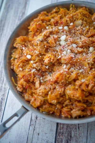 Oven roasted spaghetti squash tossed with an Italian bolognese sauce made with ground turkey, mushrooms, garlic and oregano is a deliciously, easy, healthy dinner alternative. 