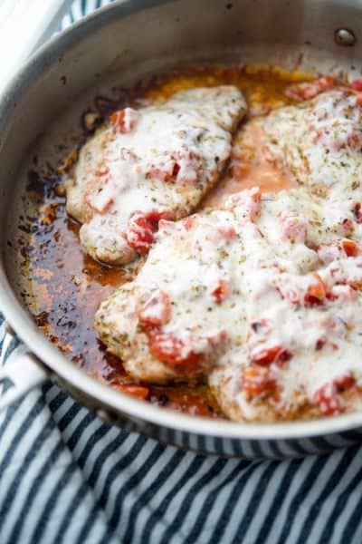 A close up of Pork Chops Pizzaiola in a pan.