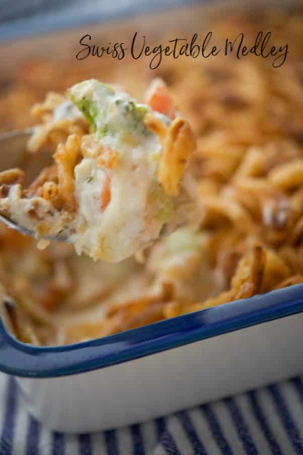 Close up of Swiss Vegetable Medley with spoon