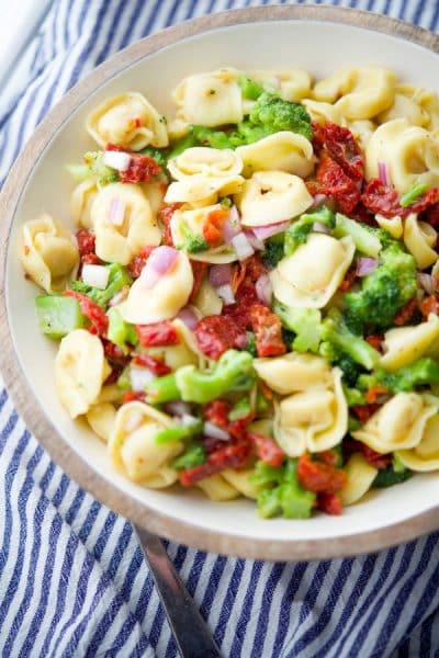 bowl of Tortellini Salad with Sun Dried Tomatoes and Broccoli