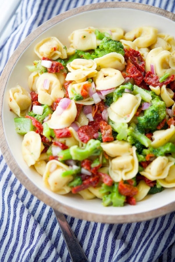 bowl of Tortellini Salad with Sun Dried Tomatoes and Broccoli 