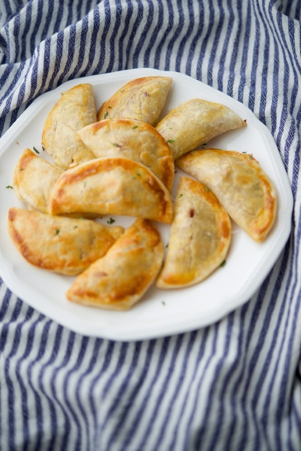 Empanadas stuffed with Portuguese chorizo, ground beef, spices and a creamy lemony sauce ; then baked until golden brown.