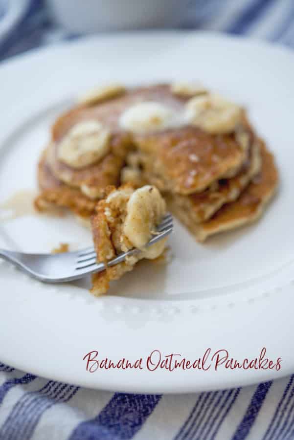 Pancakes made with rolled oats, flour, milk, eggs and fresh bananas topped with banana maple syrup is a delicious way to start the day. 