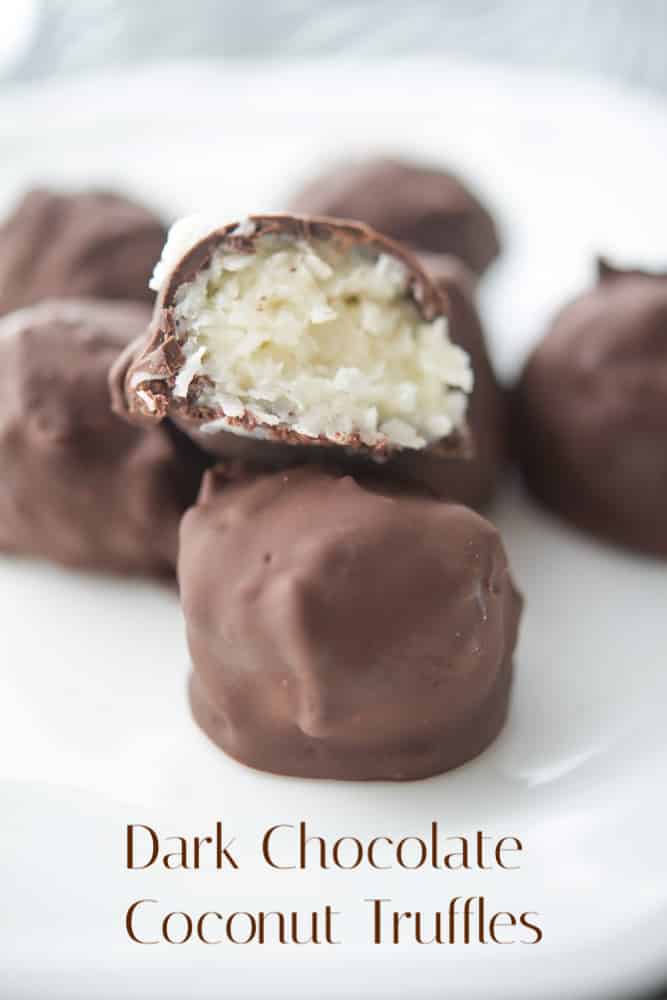 A close up the inside of chocolate covered coconut on a plate. 