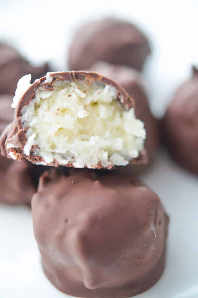 A close up of coconut truffles