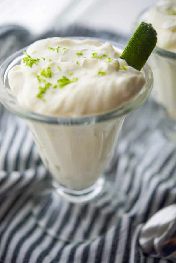 A close up of lime mousse in a glass. 