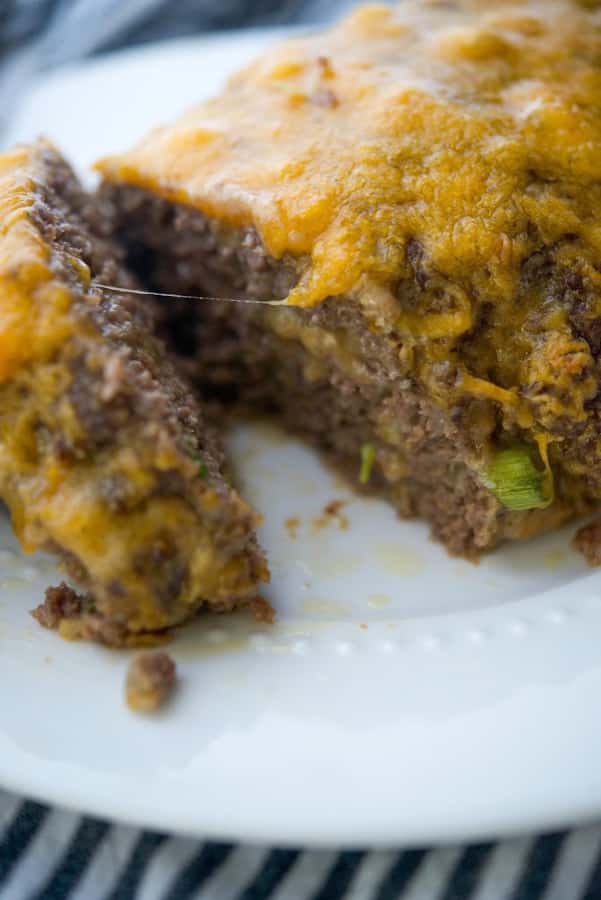 A close up of food on a plate, with Meatloaf and Cheese
