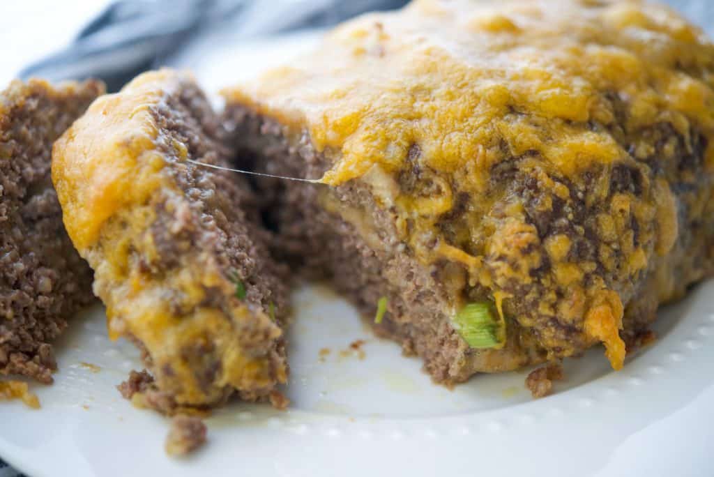 Cheesy Meatloaf on a white plate