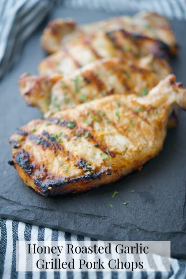 Boneless center cut pork chops marinated in a honey and roasted garlic vinaigrette; then grilled are super tender and delicious. 