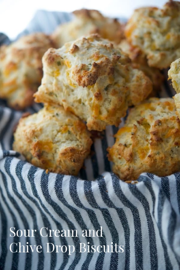 These flaky Sour Cream and Chive Drop Biscuits are so deliciously light and buttery, you'll never make homemade yeast rolls again! 