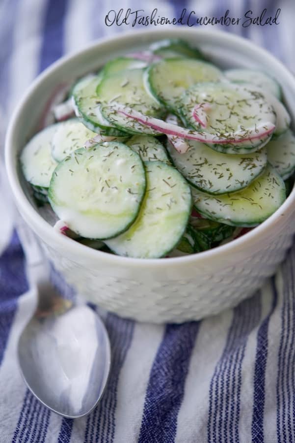 A bowl of food, with Salad and Cucumber