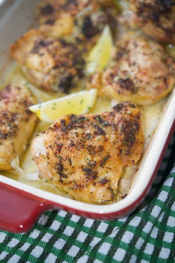 Bone-in chicken thighs topped with a mixture of fresh rosemary, lemon zest, EVOO, Kosher salt and pepper baked in a casserole dish. 