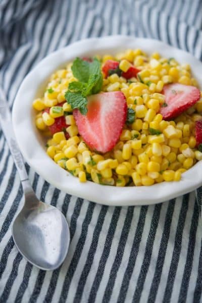 This salad made with corn kernels, ripe strawberries and fresh mint in a refreshingly light vinaigrette makes a tasty side dish for Summer gatherings.