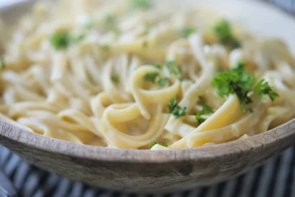 Fettuccine Alfredo in bowl closeup