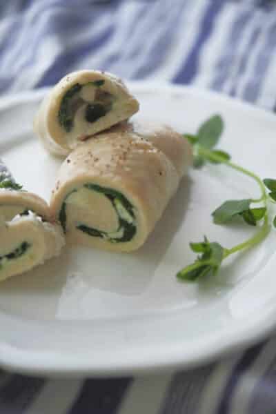 Greek Chicken Roll Ups made with boneless chicken breasts that have been stuffed with Feta cheese, spinach and fresh oregano. 