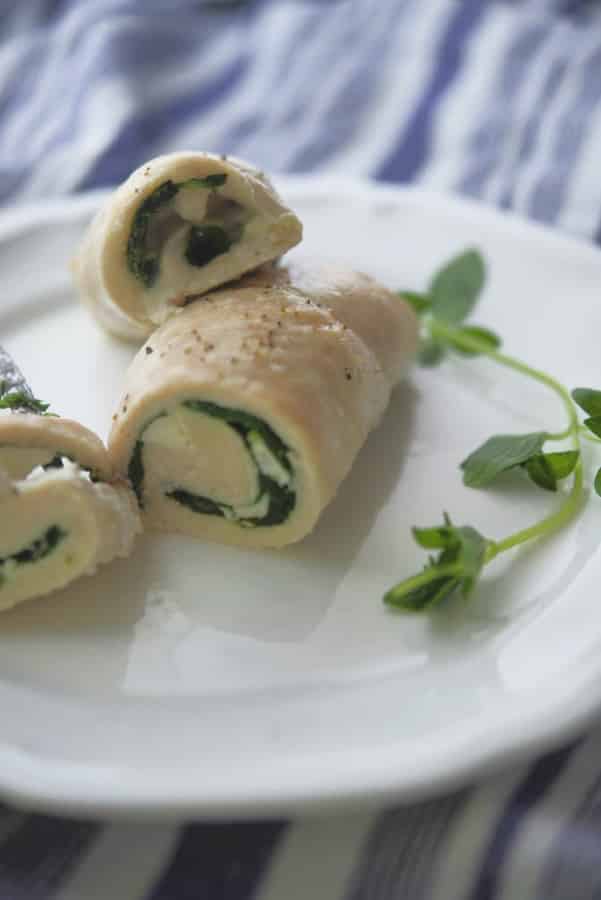 Greek Chicken Roll Ups made with boneless chicken breasts that have been stuffed with Feta cheese, spinach and fresh oregano. 